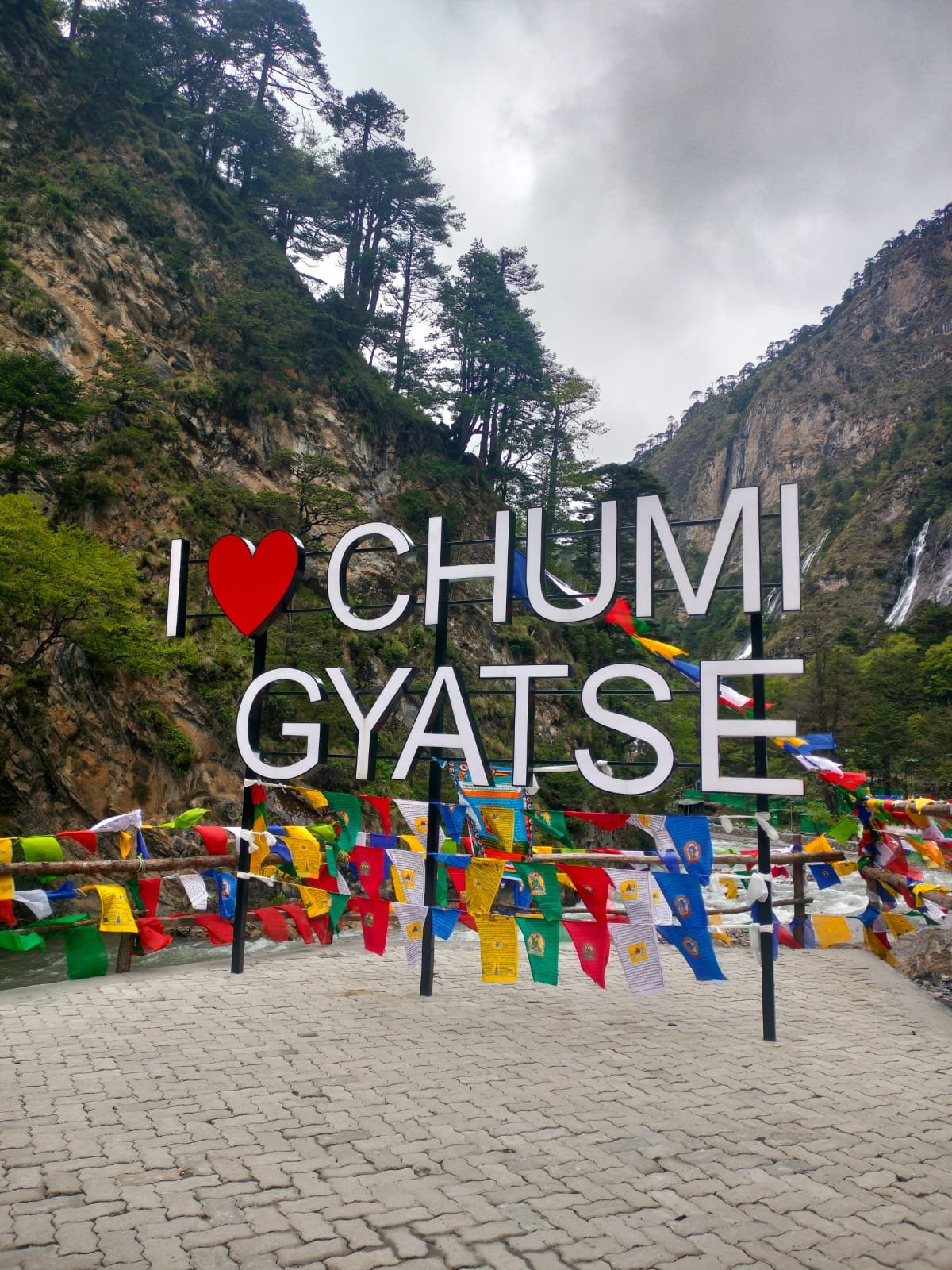 I Love Chumi Gyatse sign at the holy waterfalls near the Tawang frontier