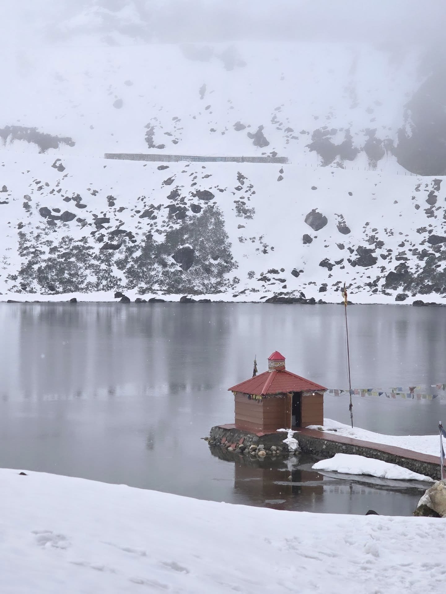 Frozen Sela Lake in deep winter snow near Sela Pass, Tawang